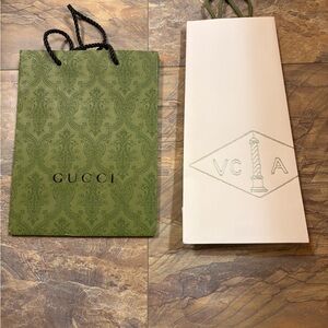 Gucci and van cleef and arpels shopping bags